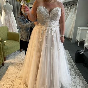 Plus size wedding gown with sewn in bra